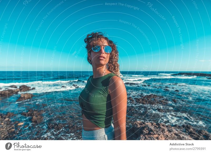 Stylish woman standing near sea Woman Ocean Coast Dream Stand Lifestyle Leisure and hobbies Rest Relaxation Waves Water Style Hip & trendy Easygoing Sunglasses