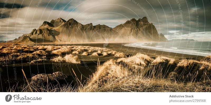 Panorama of grand cliff above water Cliff Water Reflection Panorama (Format) Majestic Iceland Mountain Landscape Nature Sky Vacation & Travel Rock Ocean Freedom