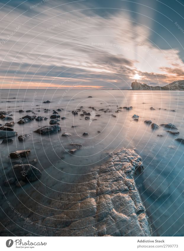 Sundown sky over sea and stony coast Sky Sunset Ocean Coast Stone Evening Nature cala charco alicante Spain Clouds Weather Cloud cover Dusk Twilight Bright Rock