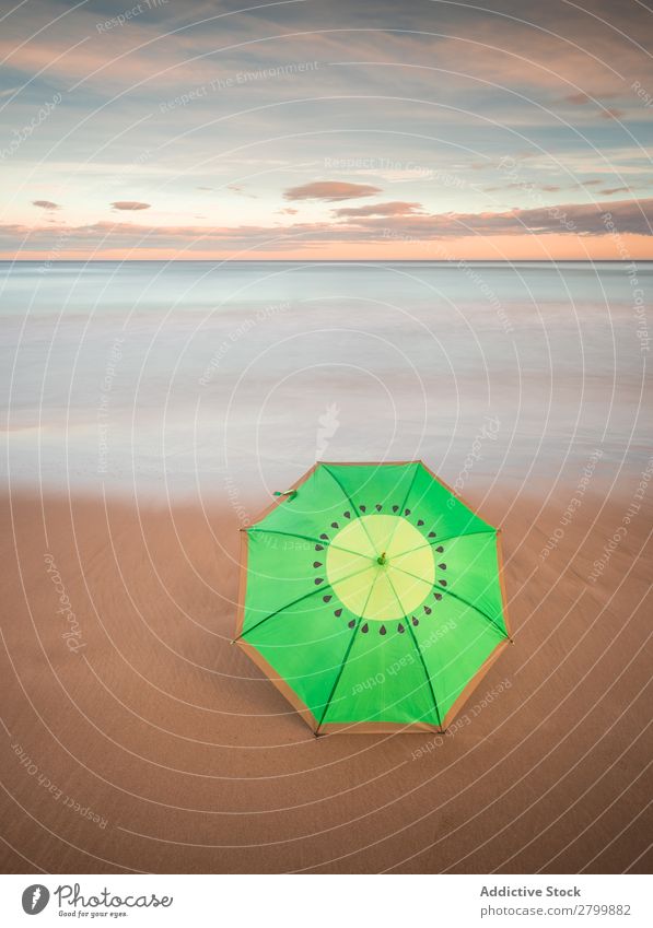 Umbrella on beach near sea Beach Ocean Sunset Evening Sky Clouds Waves Vacation & Travel Coast Sand Trip Tourism Dusk Twilight Water Paradise Resort Sunshade