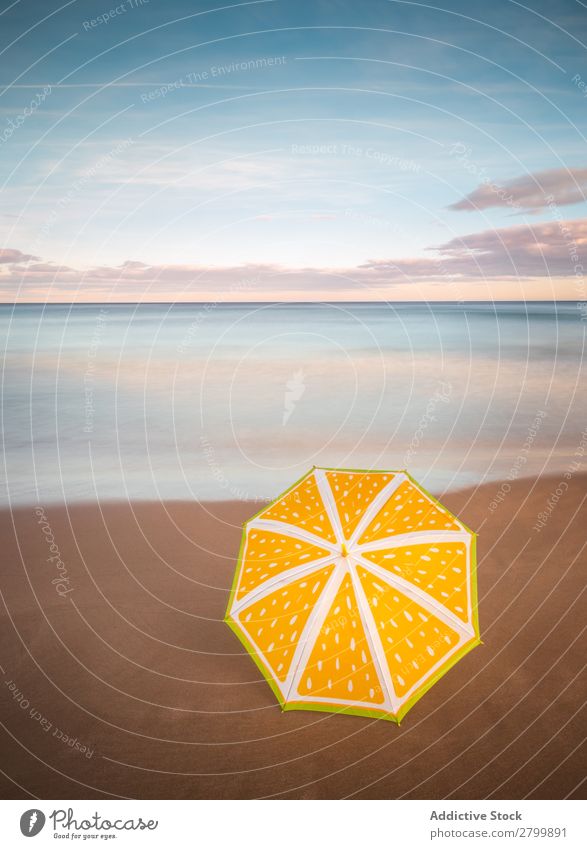 Umbrella on beach near sea Beach Ocean Sunset Evening Sky Clouds Waves Vacation & Travel Coast Sand Trip Tourism Dusk Twilight Water Paradise Resort Sunshade