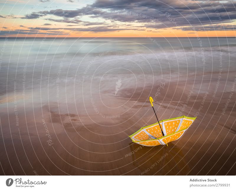 Umbrella on beach near sea Beach Ocean Sunset Evening Sky Clouds Waves Vacation & Travel Coast Sand Trip Tourism Dusk Twilight Water Paradise Resort Sunshade