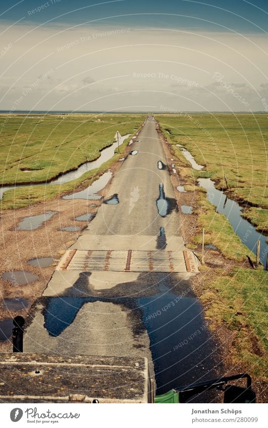 low tide Environment Nature Landscape Summer Beautiful weather North Sea Mud flats Exceptional Tractor Street Inundated Low tide High tide Safety Risk Idyll