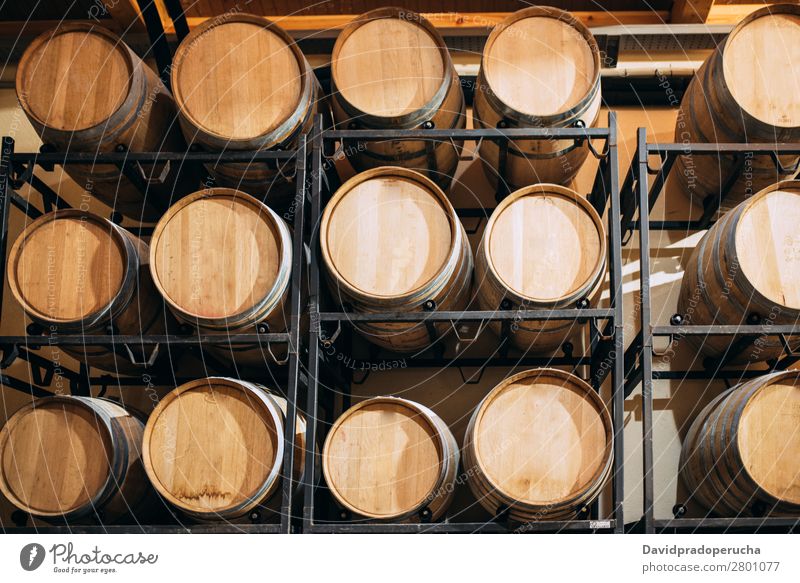 Wood wine barrels stored in a winery on the fermentation process Winery Cellar Vintage oak Storage Drinking Beverage Keg flavor Production Line Factory