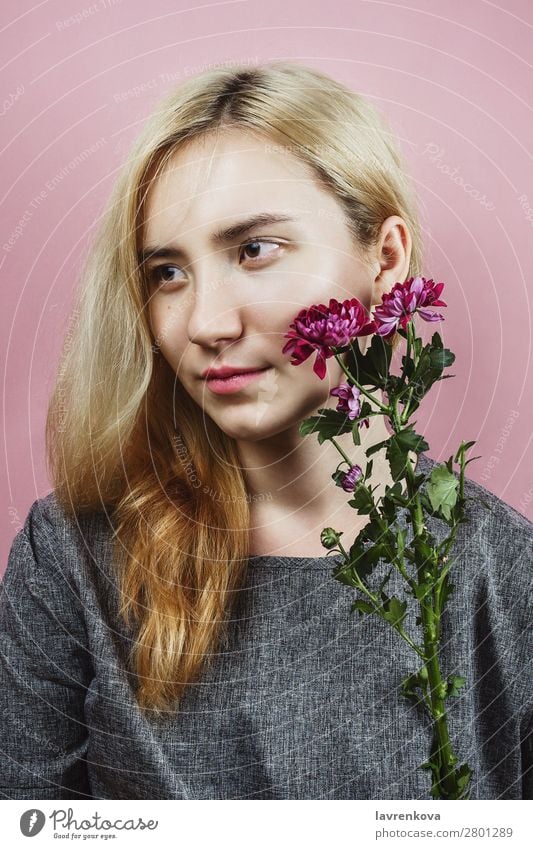 Floral portrait of female with blond hair on pink Lady Flower pretty Bouquet Chrysanthemum Pastel tone Spring Blossom Fashion Model Woman Beauty Photography Dye