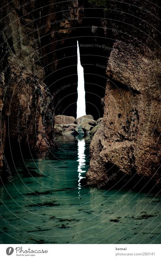 Out of the light (into the dark) Environment Nature Water Summer Rock Bay Ocean Cave Entrance Stone Dark Wet Low water Low tide Shallow Passage Opening