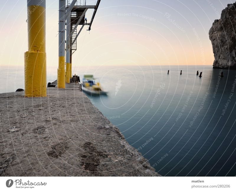 investor Aquatics Landscape Beautiful weather Rock Coast Ocean Industrial plant Pedalo Blue Yellow crimpy Colour photo Exterior shot Deserted Twilight