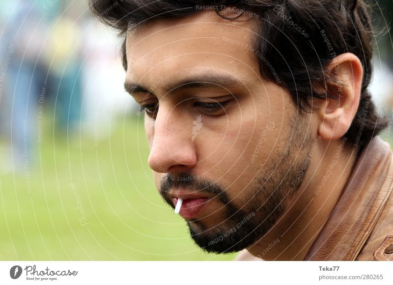 park boy Human being Masculine Young man Youth (Young adults) 1 18 - 30 years Adults Garden Park Uniqueness Brown Green Black Boredom Concern Lollipop