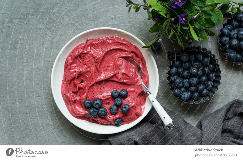 Smoothy of fresh bog blueberries and raspberries in bowl near napkin Milkshake Bowl Mature bog blueberry Raspberry Fresh Napkin Tasty Cup Table Mix Diet To feed