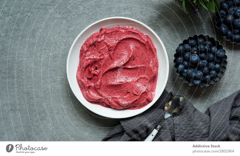 Smoothy of fresh bog blueberries and raspberries in bowl near napkin Milkshake Bowl Mature bog blueberry Raspberry Fresh Napkin Tasty Cup Table Mix Diet To feed