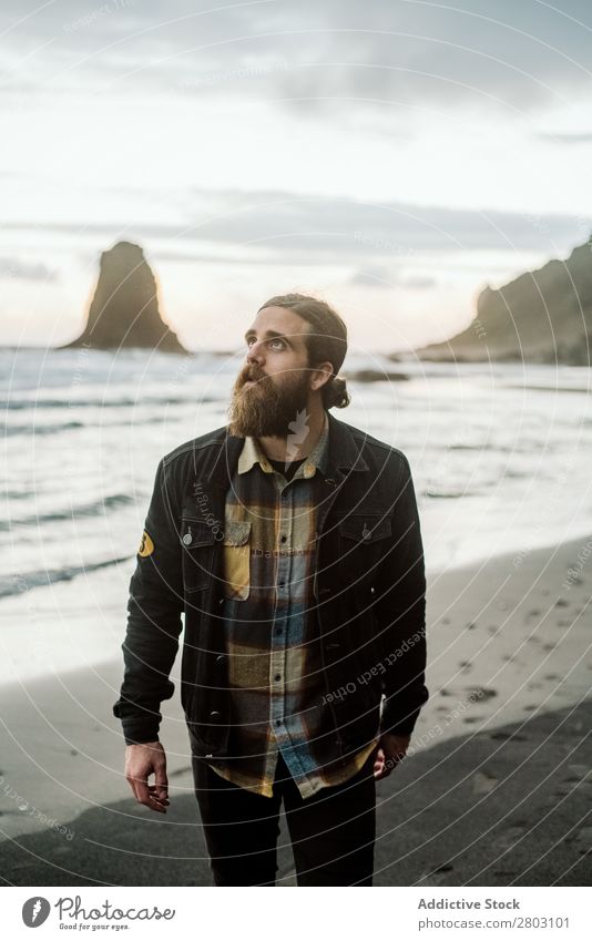 Bearded traveler looking up near sea Man Ocean Coast Looking up Dream Nature Amazed Vacation & Travel bearded Style Easygoing Hip & trendy surprised playa norte