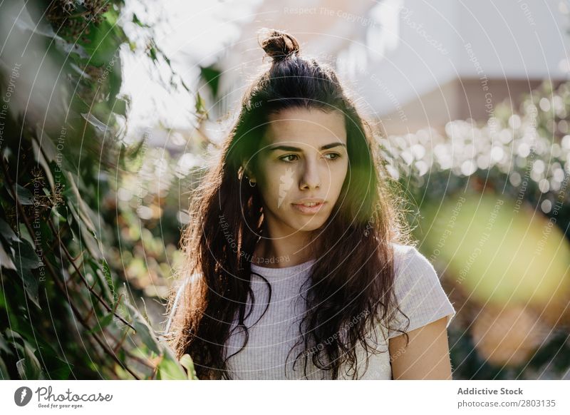 Cheerful woman in garden Woman Backyard Brunette Bushes Youth (Young adults) Sunbeam Day Gesture Garden Summer Style Easygoing Hip & trendy Park Harmonious