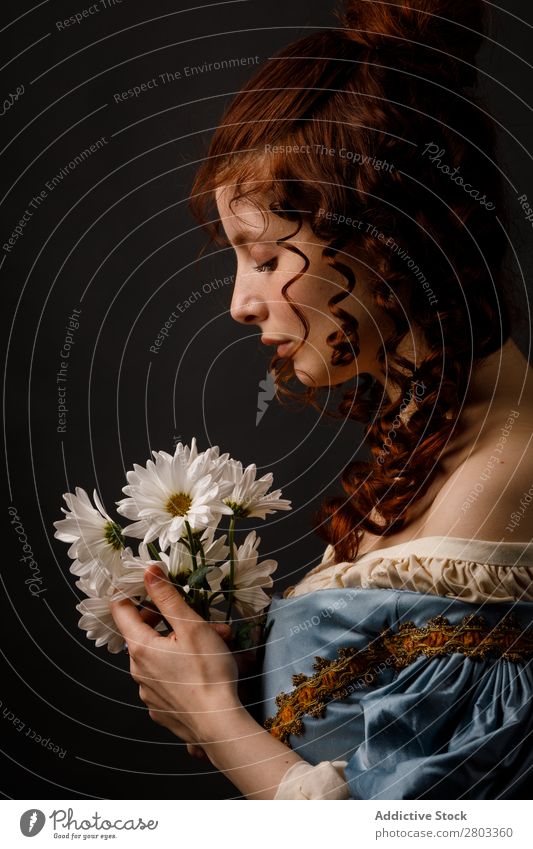 Beautiful woman in medieval clothing Woman Baroque Dress Hold Flower daisies Carnival Renaissance Princess Royal masquerade Fantasy Clothing aristocrat Fashion