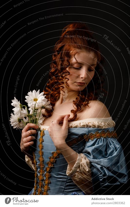 Beautiful woman in medieval clothing Woman Baroque Dress Hold Flower daisies Carnival Renaissance Princess Royal masquerade Fantasy Clothing aristocrat Fashion