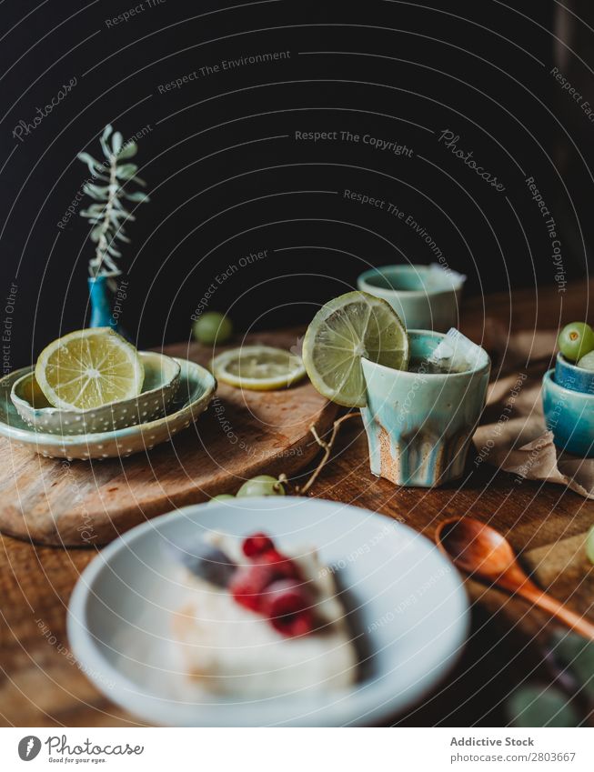 Arrangement of ceramic utensil on wood table Table Bunch of grapes Design Rustic Fresh Lemon Artisan Fruit plates Wood Creativity Natural Self-made