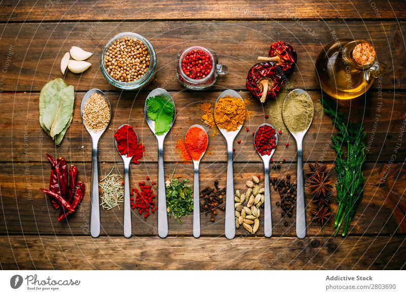 Set of various spices on table Herbs and spices Table assortment Oil Cooking Ingredients Fresh Dill Parsley Garlic anise turmeric Cardamom Coriander Chili