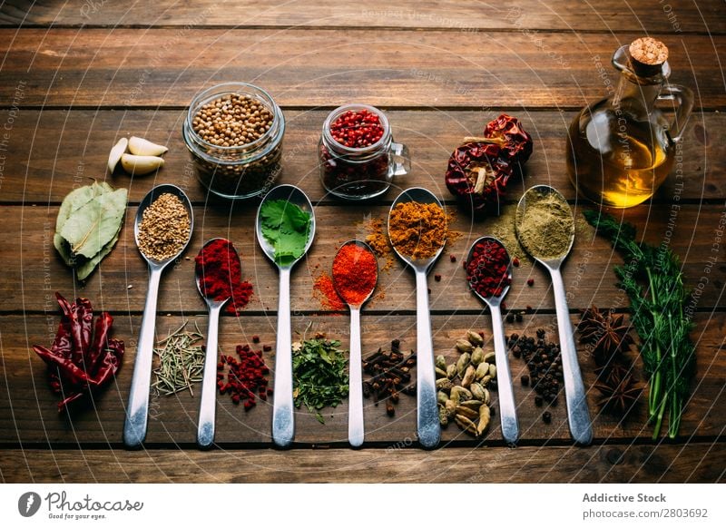 Set of various spices on table Herbs and spices Table assortment Oil Cooking Ingredients Fresh Dill Parsley Garlic anise turmeric Cardamom Coriander Chili