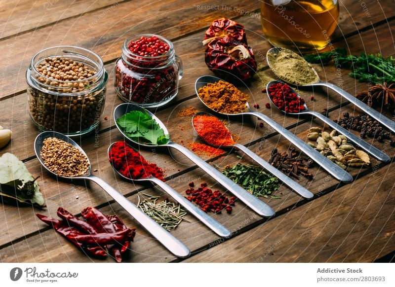 Set of various spices on table Herbs and spices Table assortment Oil Cooking Ingredients Fresh Dill Parsley Garlic anise turmeric Cardamom Coriander Chili