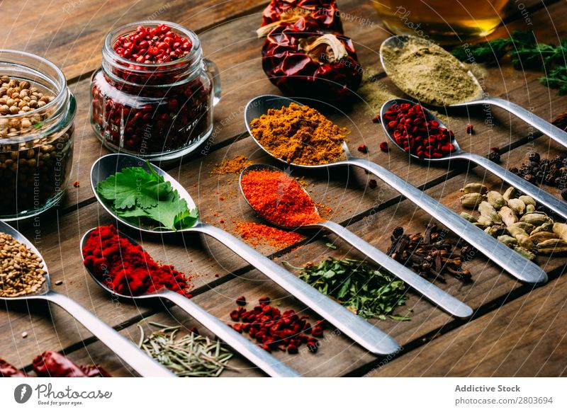 Set of various spices on table Herbs and spices Table assortment Oil Cooking Ingredients Fresh Dill Parsley Garlic anise turmeric Cardamom Coriander Chili