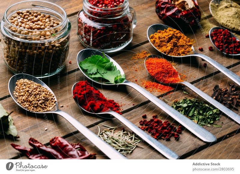 Set of various spices on table Herbs and spices Table assortment Oil Cooking Ingredients Fresh Dill Parsley Garlic anise turmeric Cardamom Coriander Chili