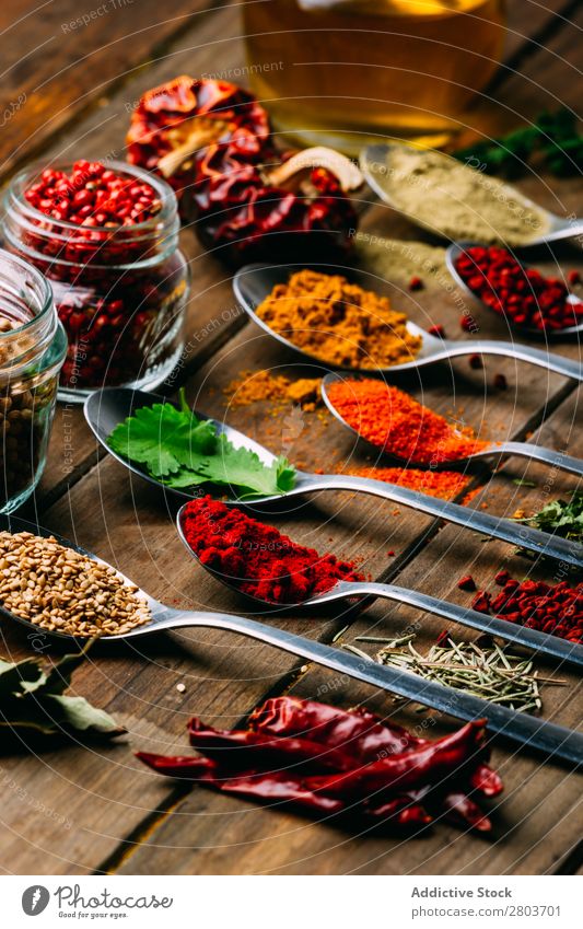 Set of various spices on table Herbs and spices Table assortment Oil Cooking Ingredients Fresh Dill Parsley Garlic anise turmeric Cardamom Coriander Chili