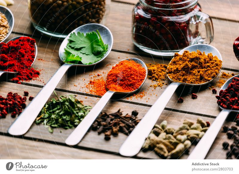 Set of various spices on table Herbs and spices Table assortment Oil Cooking Ingredients Fresh Dill Parsley Garlic anise turmeric Cardamom Coriander Chili