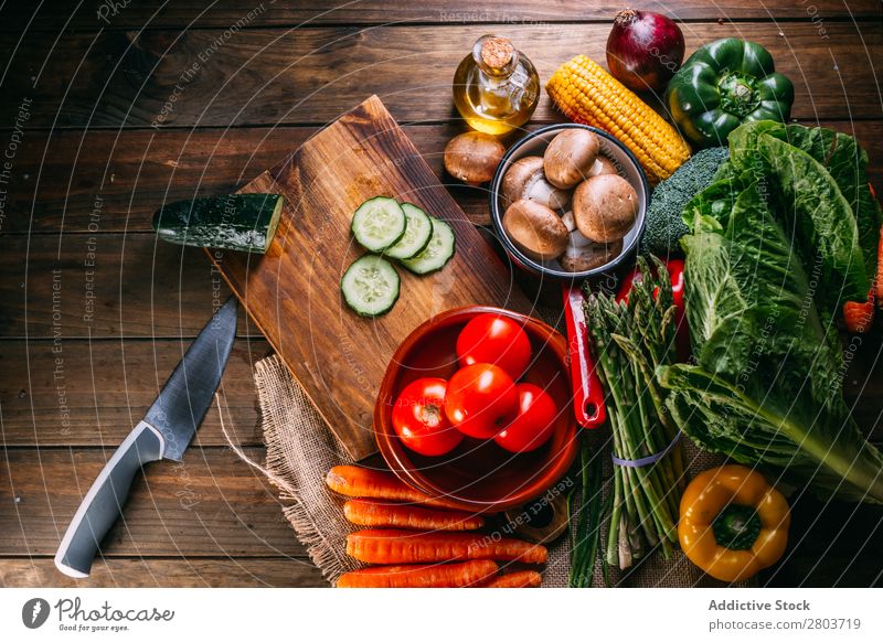 Vegetables and utensils on kitchen table Cooking Table Linen assortment Fresh Food Healthy Organic Vegan diet Knives Chopping board Kitchen Lettuce Broccoli