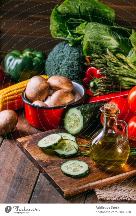 Vegetables and utensils on kitchen table Fresh Vitamin flat lay Oil composition Vertical corn Onion Ingredients Knives Pepper Bird's-eye view Food Cucumber Diet