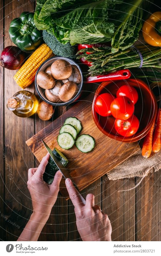 Vegetables and utensils on kitchen table Fresh Vitamin flat lay Oil composition Vertical corn Onion Ingredients Knives Pepper Bird's-eye view Food Cooking Table