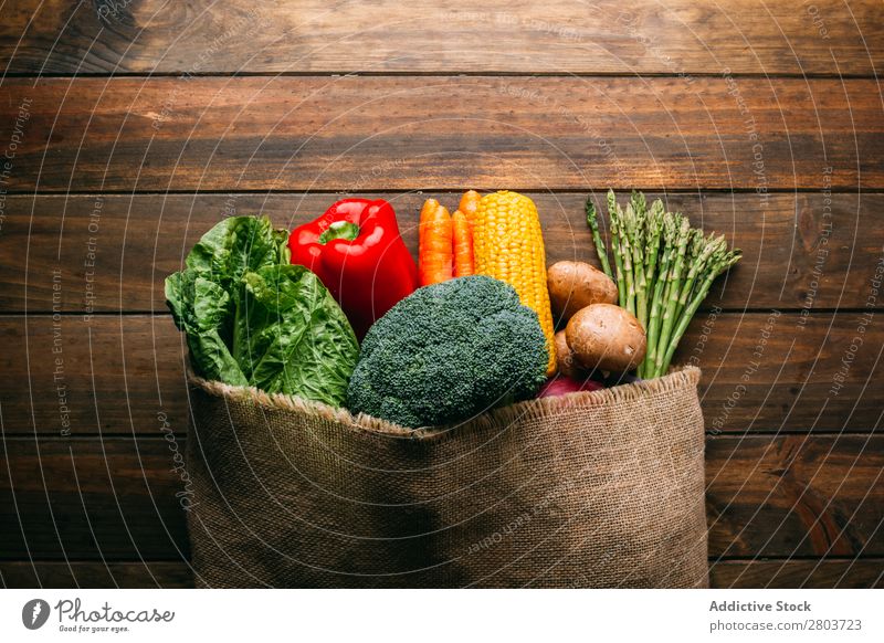 Linen sack with assorted vegetables on table Vegetable Bag Table assortment Fresh Food Healthy Organic Vegan diet Kitchen Sack Lettuce Broccoli Shopping