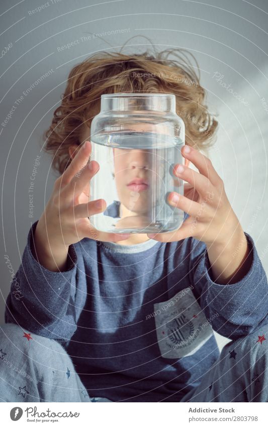 Boy holding vase with water near face Boy (child) Vase Water Clean Transparent Home Wall (building) White Face Easygoing Child Purity Clear Fresh Joy Cute