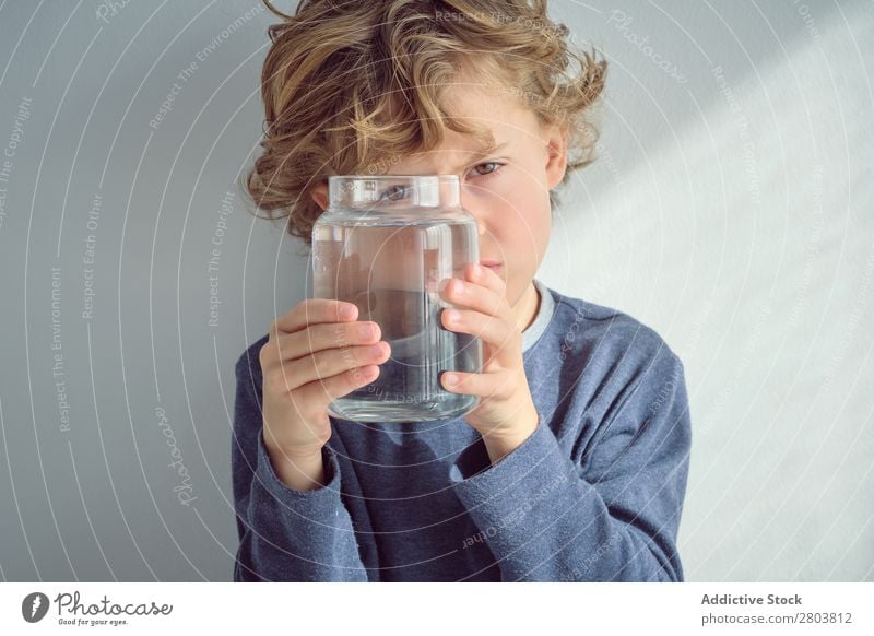 Boy holding vase with water near face Boy (child) Vase Water Clean Transparent Home Wall (building) White Face Easygoing Child Purity Clear Fresh Cheerful Joy