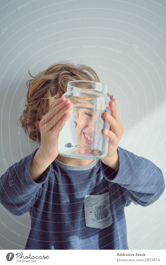 Boy holding vase with water near face Boy (child) Vase Water Clean Transparent Home Wall (building) White Face Easygoing Child Purity Clear Fresh Cheerful Joy