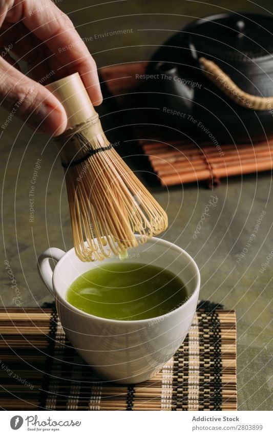 Preparing matcha tea Powder Wood Hand Herbs and spices Man Cup Drinking Tea Beater Scoop Japanese Teapot assorted Green Healthy Beverage Dark Water brew Bamboo