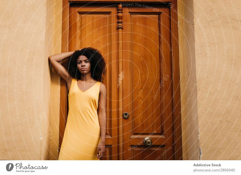 Gorgeous black woman in dress on street Woman Door Black Dress Curly Town To enjoy Barefoot Ethnic African-American Afro Beautiful tender Body Self-confident