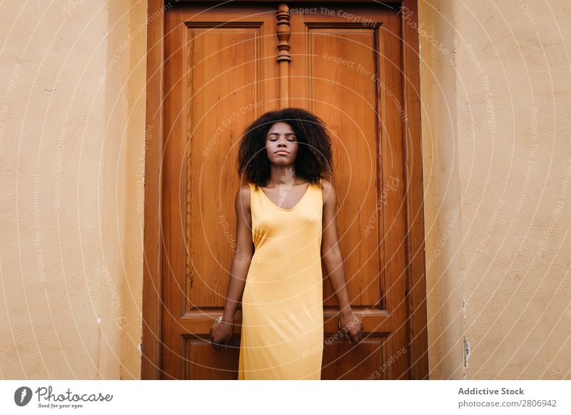 Gorgeous black woman in dress on street Woman Door Black Dress Curly Town To enjoy Barefoot Ethnic African-American Afro Beautiful tender Body Self-confident