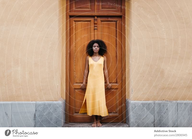 Gorgeous black woman in dress on street Woman Door Black Dress Curly Town To enjoy Barefoot Ethnic African-American Afro Beautiful tender Body Self-confident