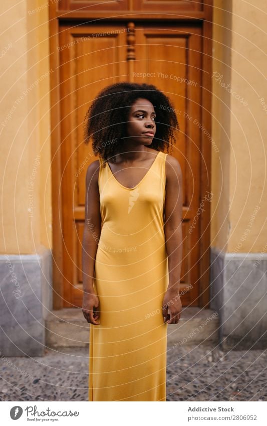 Gorgeous black woman in dress on street Woman Door Black Dress Curly Town To enjoy Barefoot Ethnic African-American Afro Beautiful tender Body Self-confident