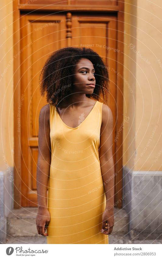 Gorgeous black woman in dress on street Woman Door Black Dress Curly Town To enjoy Barefoot Ethnic African-American Afro Beautiful tender Body Self-confident