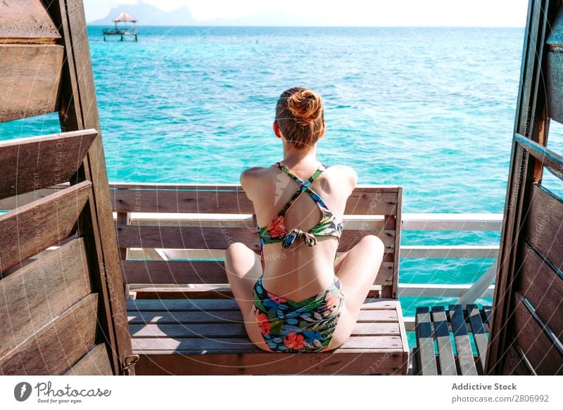 Woman in bikini sitting on bench near water Bikini Ocean Bench Water Jamaica Sunglasses Swimsuit Seat Blue Tropical Exotic Sit Accessory Summer Thin Lady