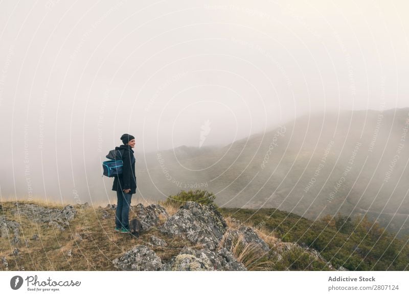 Woman hiking on a cloudy autumn day Autumn Cold Hat Portrait photograph Adults Youth (Young adults) Happy Clouds Beautiful Nature Human being White Winter