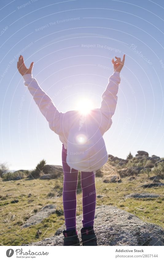 Little girl enjoys and plays in the sunlight on the hill Cute Day Girl Sunlight Hill Background picture Field pretty Freedom Spring Grass Nature Small Beautiful