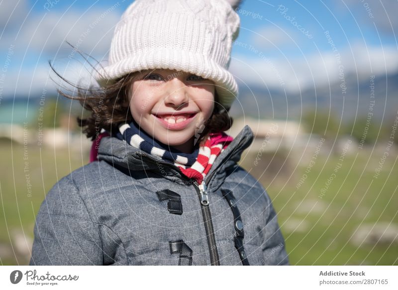 Close-up of a little girl with wool cap and scarf in the field Girl Small Child Portrait photograph Background picture Wool Beautiful Exterior shot Field Hat