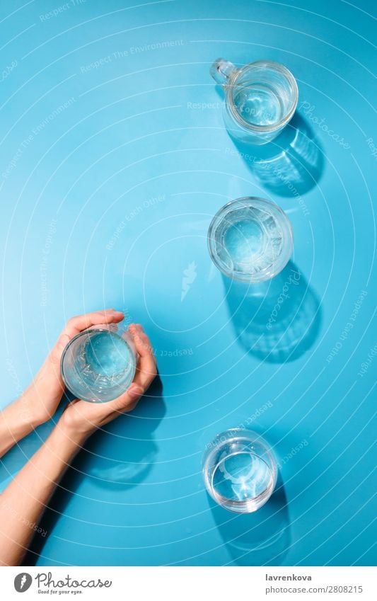 Woman's hands holding a cup of clean sparkling water Fresh Clean Bottle Object photography Beverage Drinking Cold Summer Cup jar Difference Glass Caucasian