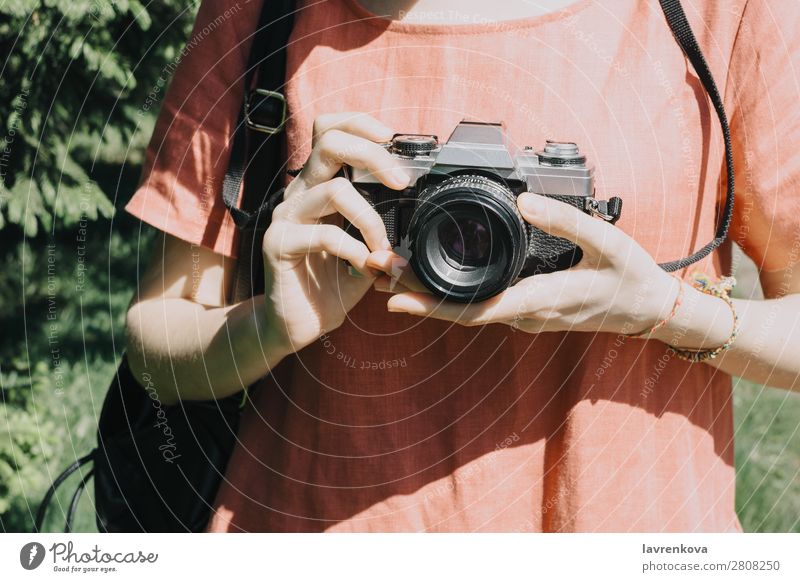 Portrait of young adult woman with vintage film camera outdoors Summer Tree Caucasian White pretty Photographer Hat Woman City Park Tourist Vacation & Travel