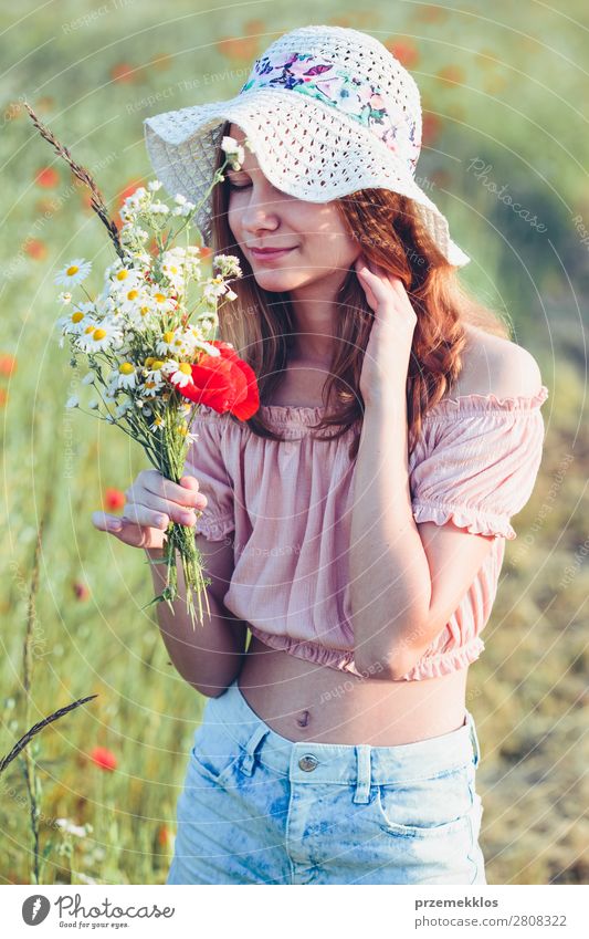 Beautieful young girl in the field of wild flowers Lifestyle Joy Happy Beautiful Summer Garden Child Human being Woman Adults Parents Mother Family & Relations