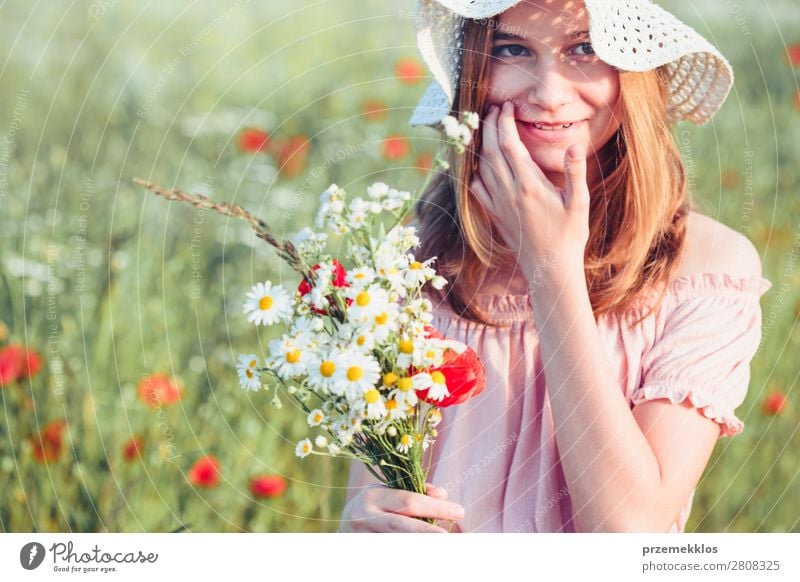 Beautieful young girl in the field of wild flowers Lifestyle Joy Happy Beautiful Summer Garden Child Human being Woman Adults Parents Mother Family & Relations