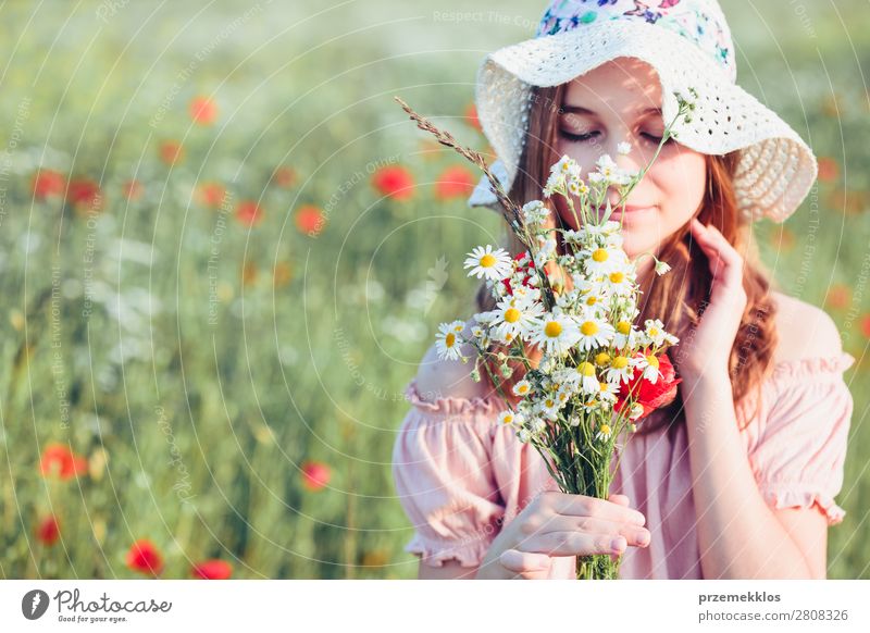 Beautieful young girl in the field of wild flowers Lifestyle Joy Happy Beautiful Summer Garden Child Human being Woman Adults Parents Mother Family & Relations