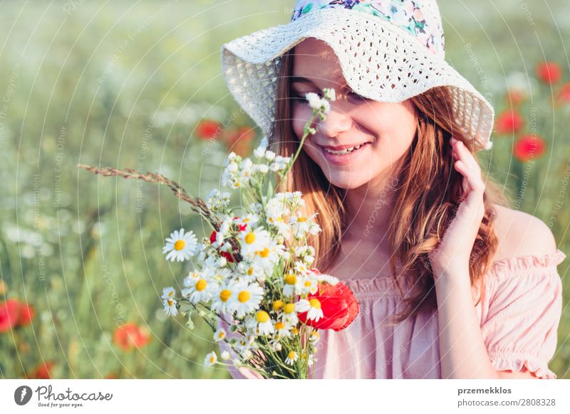 Beautieful young girl in the field of wild flowers Lifestyle Joy Happy Beautiful Summer Garden Child Human being Woman Adults Parents Mother Family & Relations