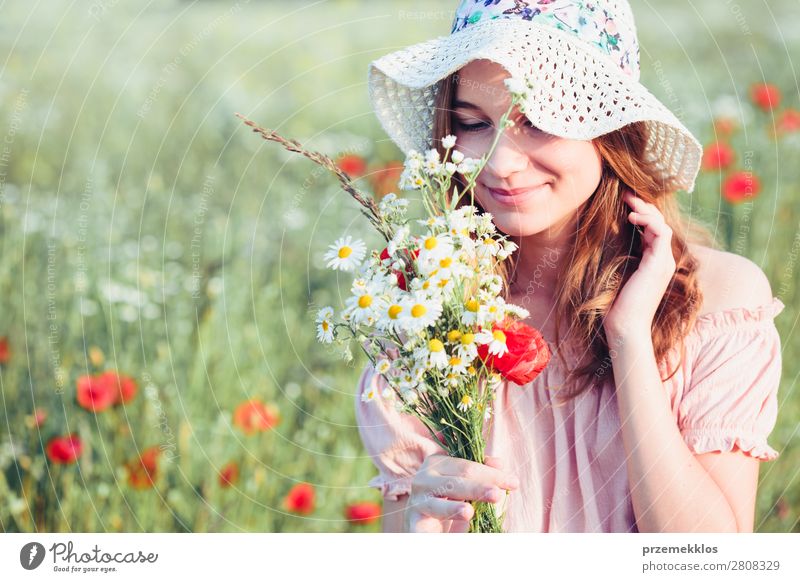 Beautieful young girl in the field of wild flowers Lifestyle Joy Happy Beautiful Summer Garden Child Human being Woman Adults Parents Mother Family & Relations